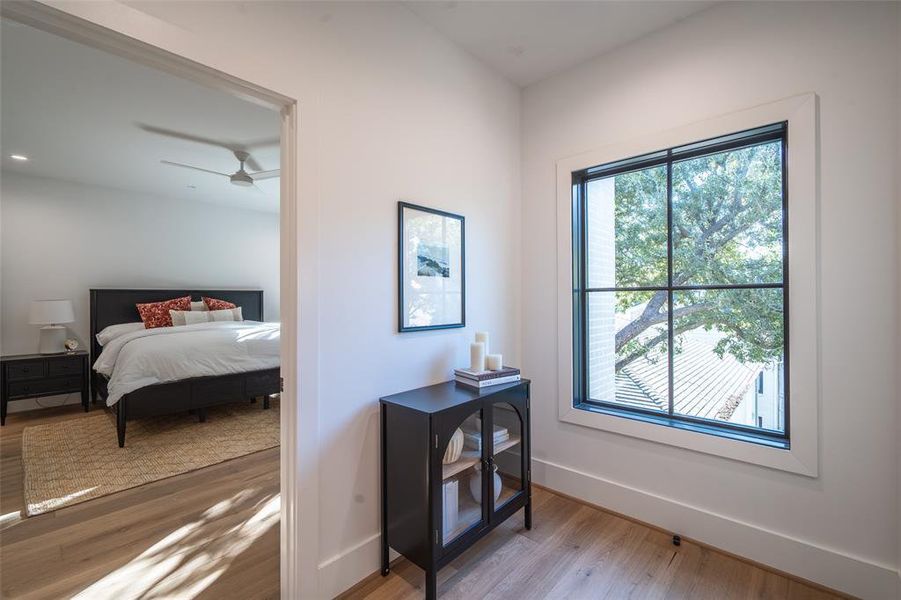 Bedroom featuring light hardwood / wood-style floors and ceiling fan