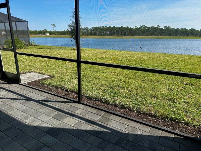 Exterior details and patio area of a home in Island Lakes at Coco Bay: Executive Homes, Englewood (Image 2).