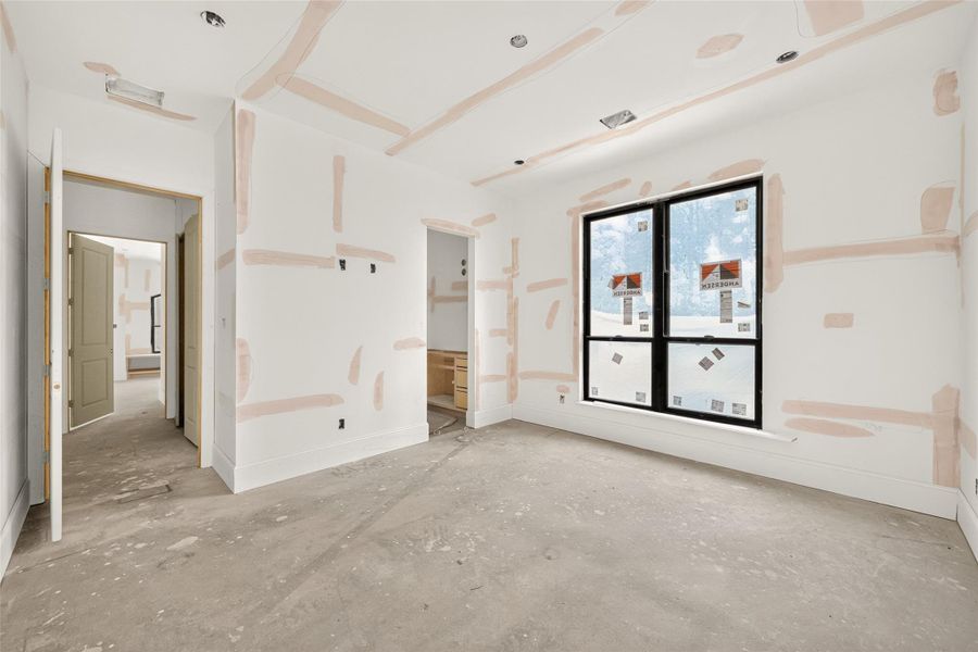 Bedroom three with view of the hallway and jack and jill entry.