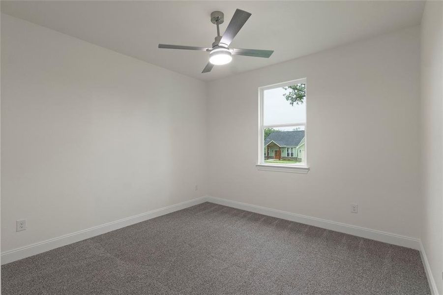 Neutral-toned wall paint and grey carpeting create a versatile foundation Neutral-toned wall paint and grey carpeting create a versatile foundation