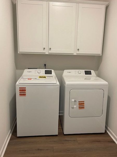 This dedicated laundry space offers convenience wi