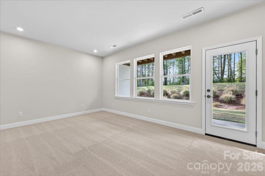 First floor flex space with access to the covered outdoor living space