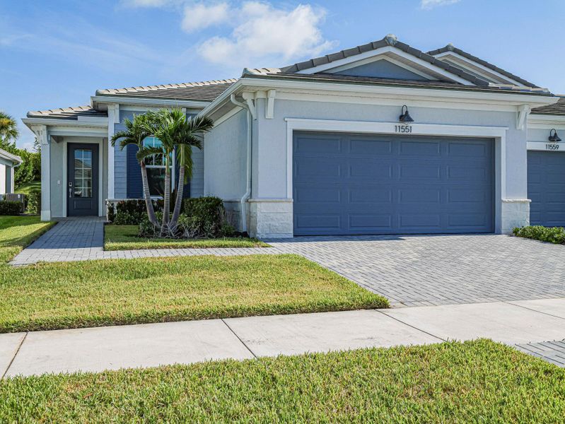 Front exterior of a new home in , Port St. Lucie, FL, highlighting curb appeal (Image 17).