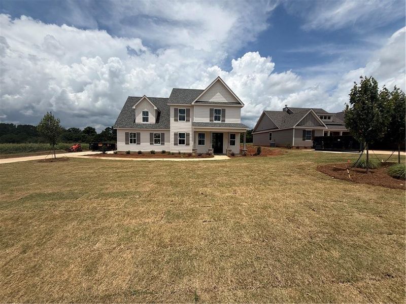 Front exterior of a new home in , Madison, GA, highlighting curb appeal (Image 2). Front exterior of a new home in , Madison, GA, highlighting curb appeal (Image 2).
