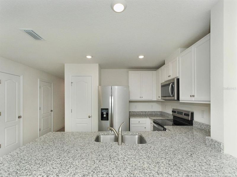 Furnished interior view inside a new home in , Harmony (Image 9).