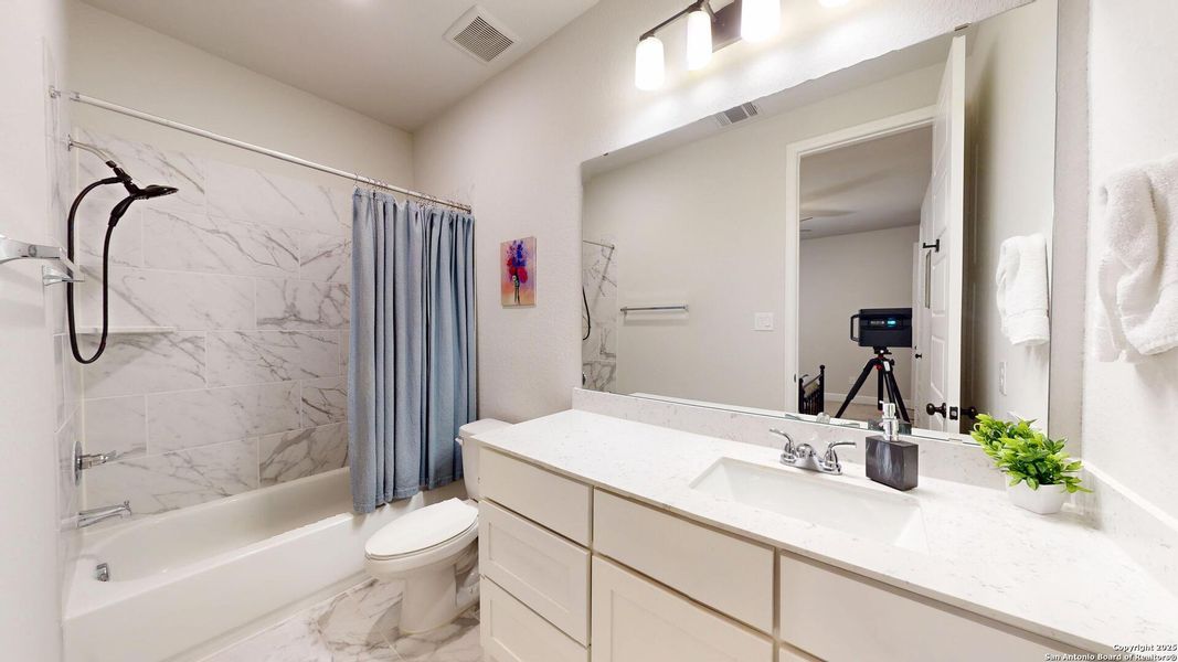 Furnished interior view inside a new home in Weston Oaks 55', San Antonio (Image 9).