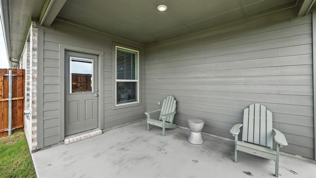 Exterior details and patio area of a home in Monarch at the Meadows, Denton (Image 2). Exterior details and patio area of a home in Monarch at the Meadows, Denton (Image 2).