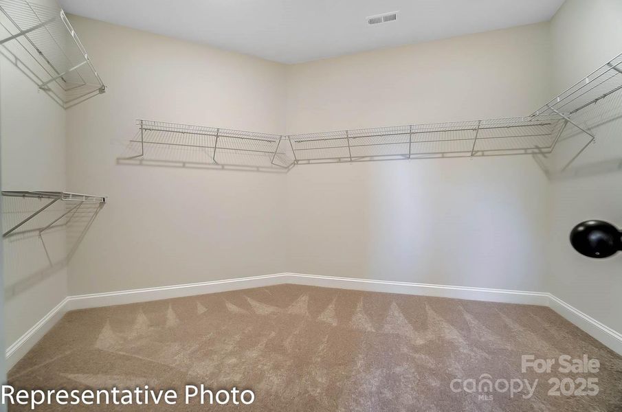 Spacious primary walk-in-closet