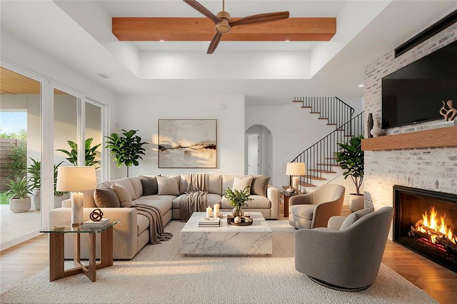 VIRTUALLY STAGED: Spacious living area featuring a tray ceiling with wood-finish beam and ceiling fan, large sliding glass doors, a white brick fireplace with wood-finish mantel, and a staircase with metal balusters