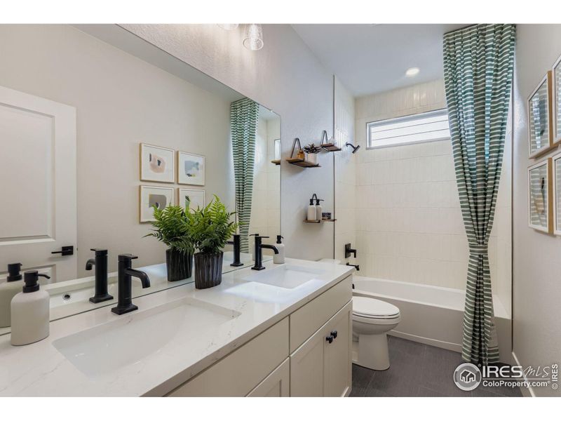 double sink in second bathroom, high end tile, quartz counters