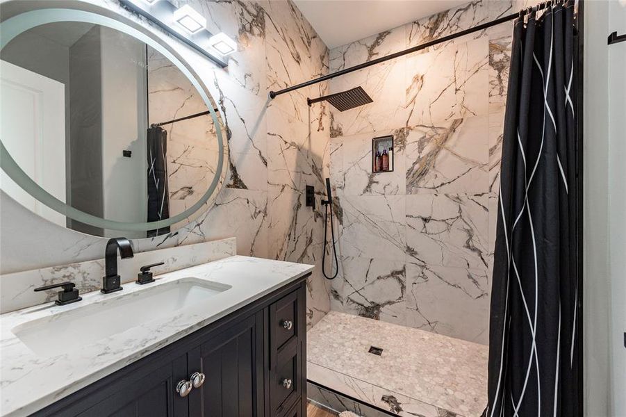 Each of the three full bathrooms boasts modern fixtures and upscale finishes, including spa-like showers and elegant tile work for ultimate comfort and style.