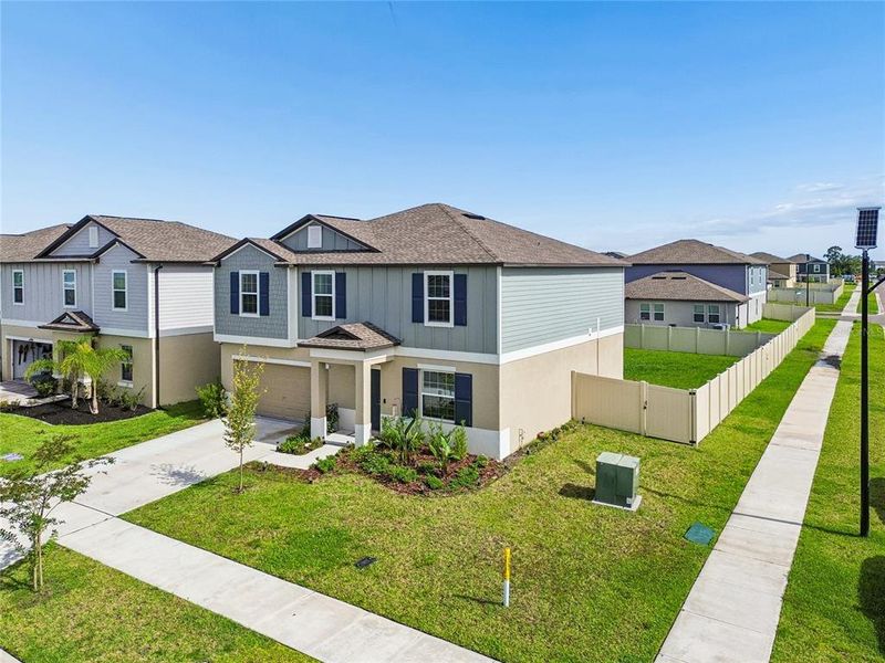 Front exterior of a new home in , Land O' Lakes, FL, highlighting curb appeal (Image 27).