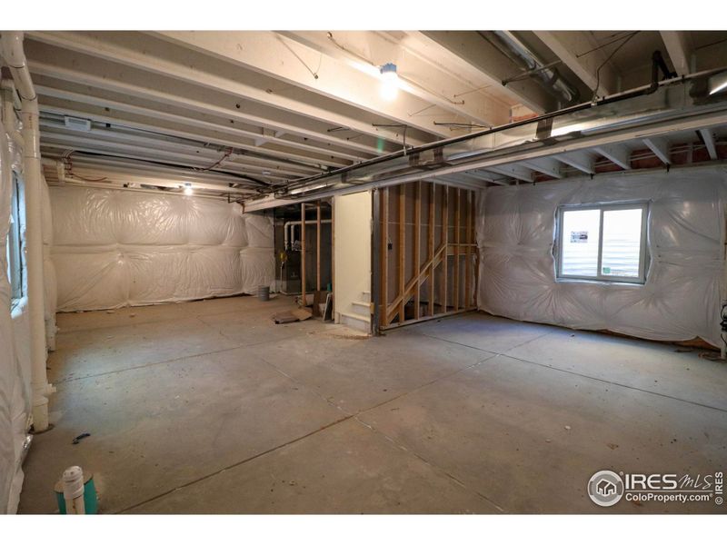 Full, unfinished basement with rough-ins