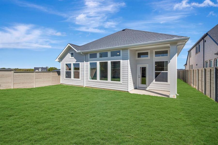Exterior details and patio area of a home in Treeline, Justin (Image 2).
