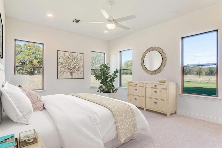 Bedroom featuring light colored carpet, recessed lighting, and a ceiling fan Bedroom featuring light colored carpet, recessed lighting, and a ceiling fan