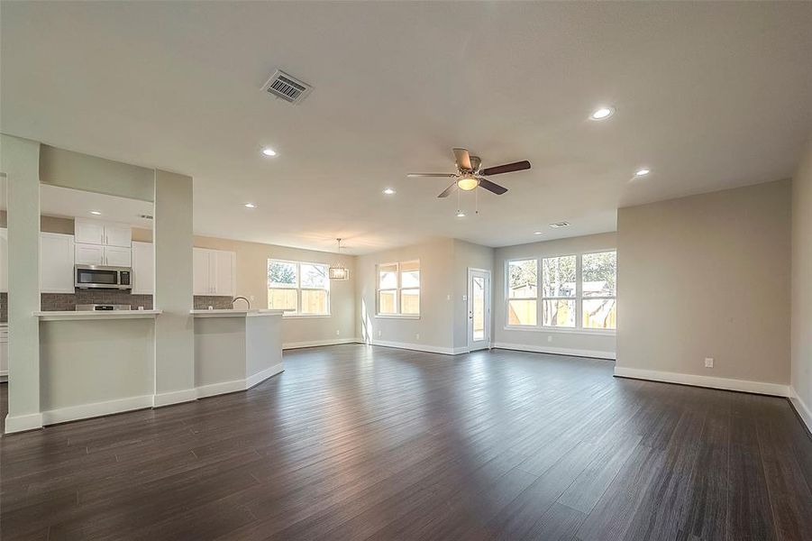 Open concept living room with high ceilings