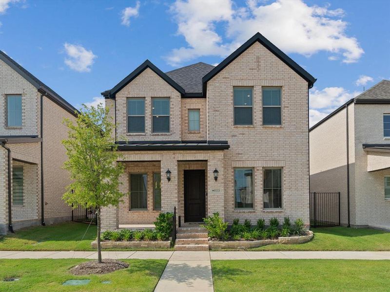 Front exterior of a new home in Village on Main Street, Frisco, TX, highlighting curb appeal (Image 22).
