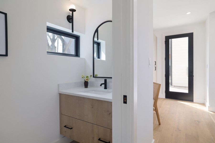 Bathroom with vanity and light wood finished floors