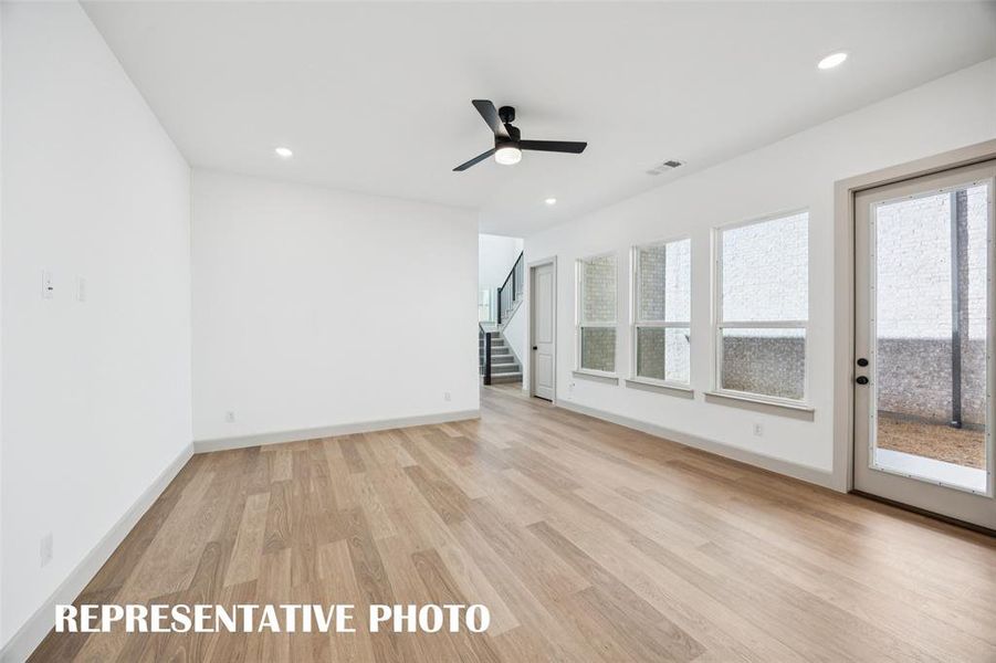 This dream home offers a light, bright and airy family room large enough to host the entire family!  REPRESENTATIVE PHOTO