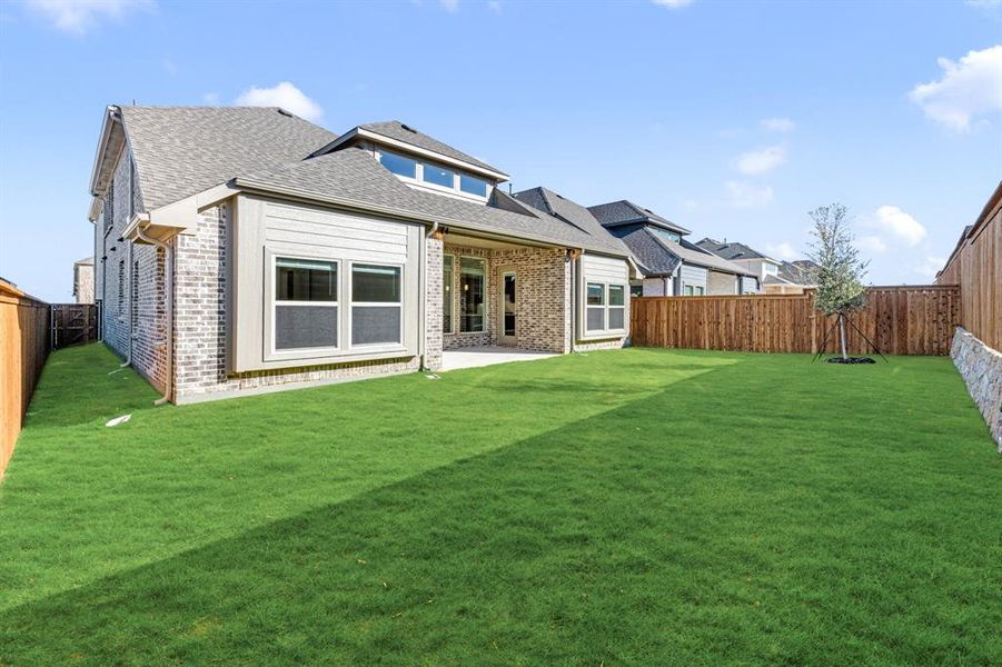 Exterior details and patio area of a home in Creekview Meadows, Pilot Point (Image 26).