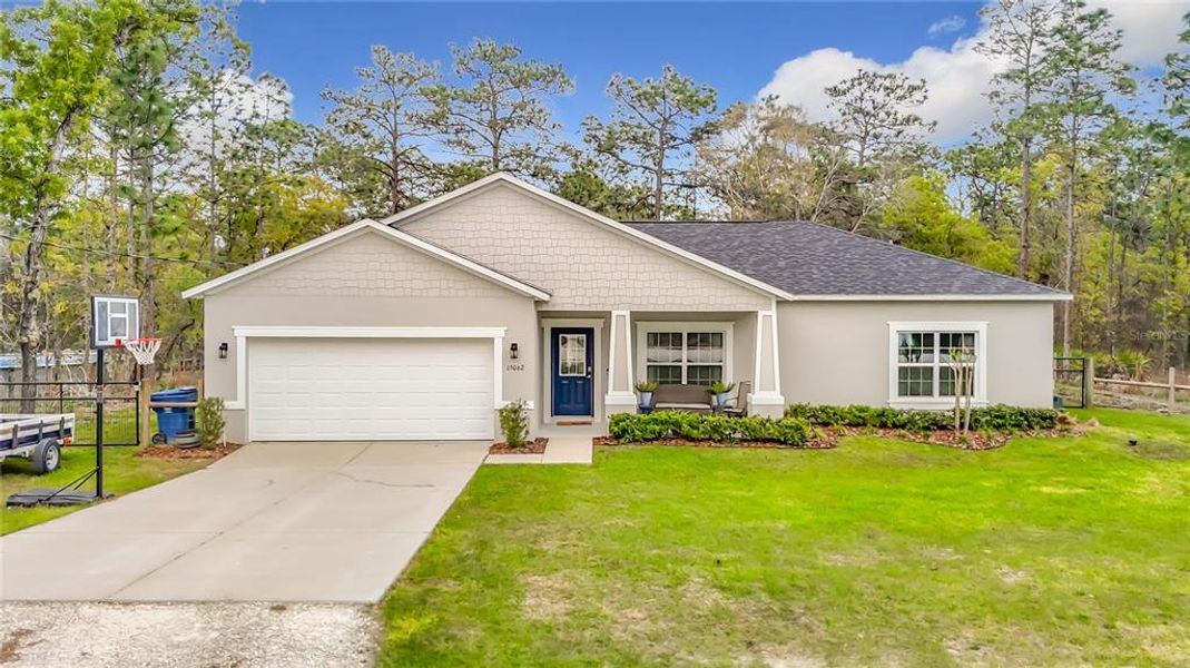 Front exterior of a new home in , Weeki Wachee, FL, highlighting curb appeal (Image 2). Front exterior of a new home in , Weeki Wachee, FL, highlighting curb appeal (Image 2).