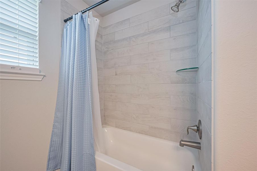 Furnished interior view inside a new home in Sunterra, Katy (Image 28).