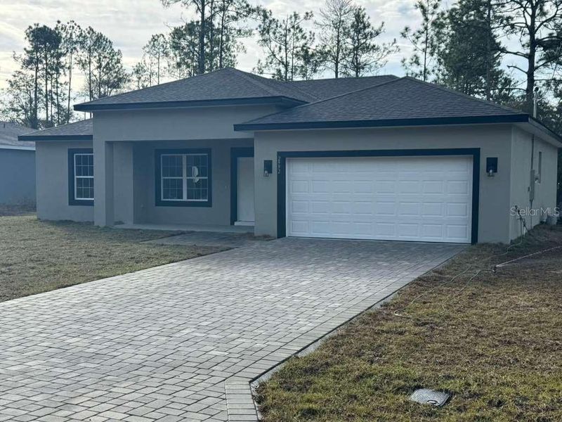 Front exterior of a new home in , Dunnellon, FL, highlighting curb appeal (Image 2). Front exterior of a new home in , Dunnellon, FL, highlighting curb appeal (Image 2).