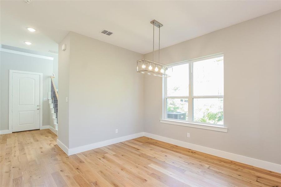 Spare room with light hardwood / wood-style floors