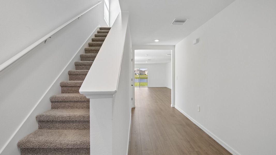 Representative unfurnished interior of a home built from the Robie Modern by D.R. Horton in Berry Bay, Wimauma (Image 13).