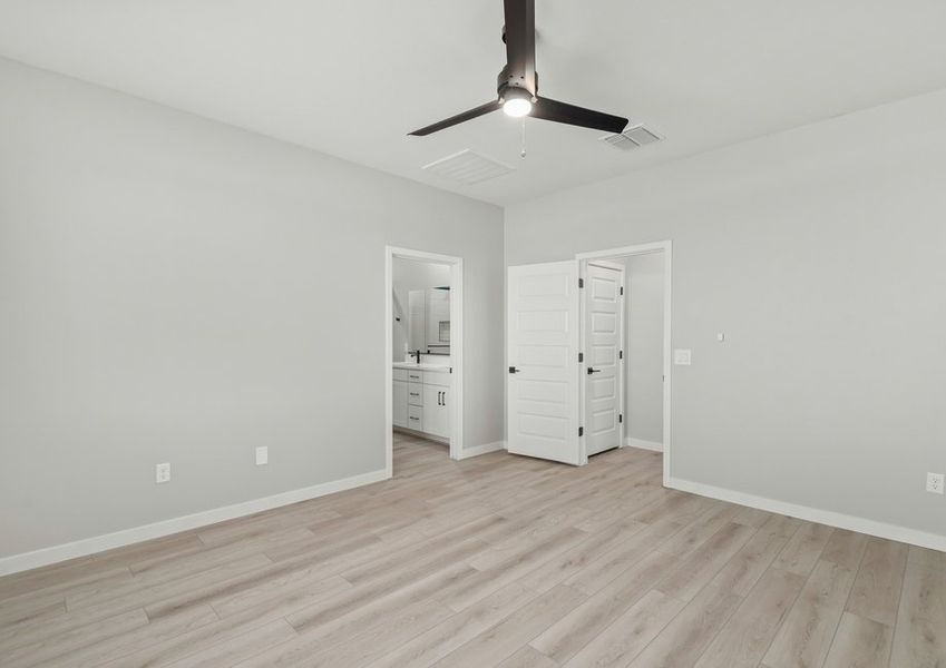 The master bedroom seamlessly connects to the bathroom and closet.