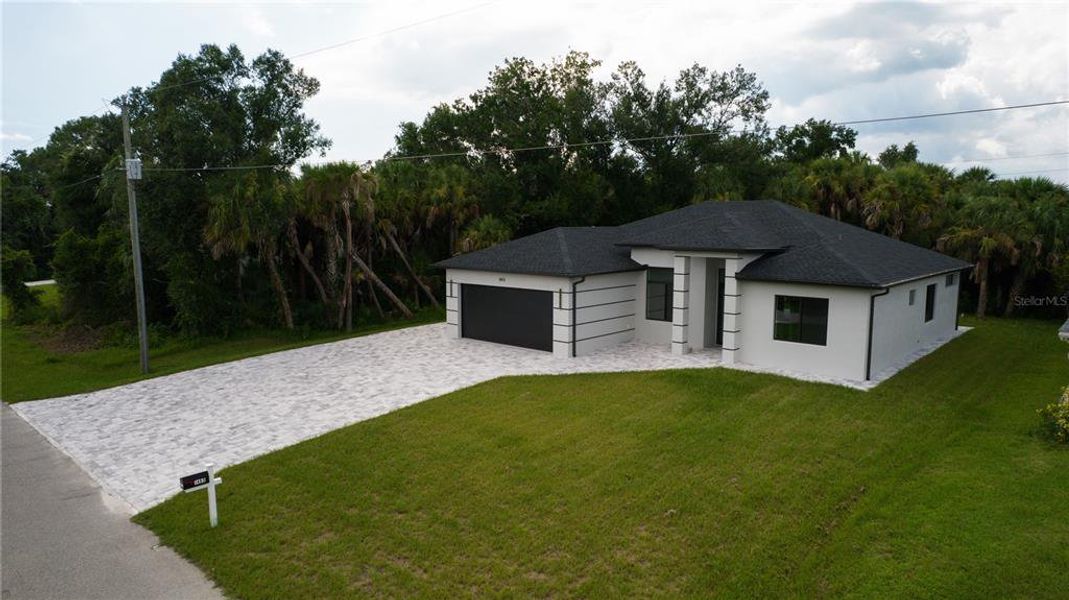 Front exterior of a new home in , North Port, FL, highlighting curb appeal (Image 24).