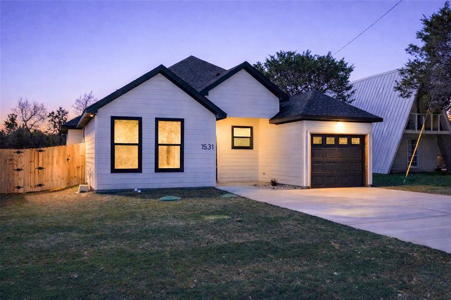 Front exterior of a new home in , Granbury, TX, highlighting curb appeal (Image 25).