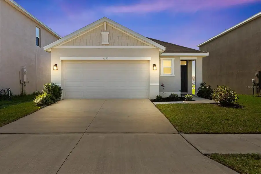 Front exterior of a new home in , Wesley Chapel, FL, highlighting curb appeal (Image 2). Front exterior of a new home in , Wesley Chapel, FL, highlighting curb appeal (Image 2).
