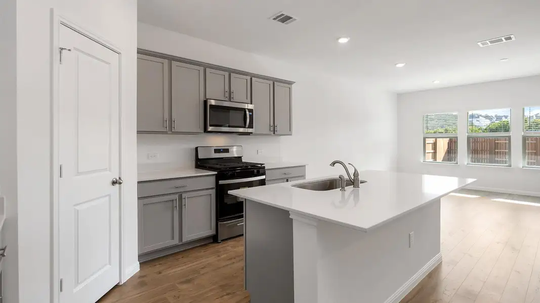 Furnished interior view inside a new home in Bar W Ranch, Leander (Image 7).