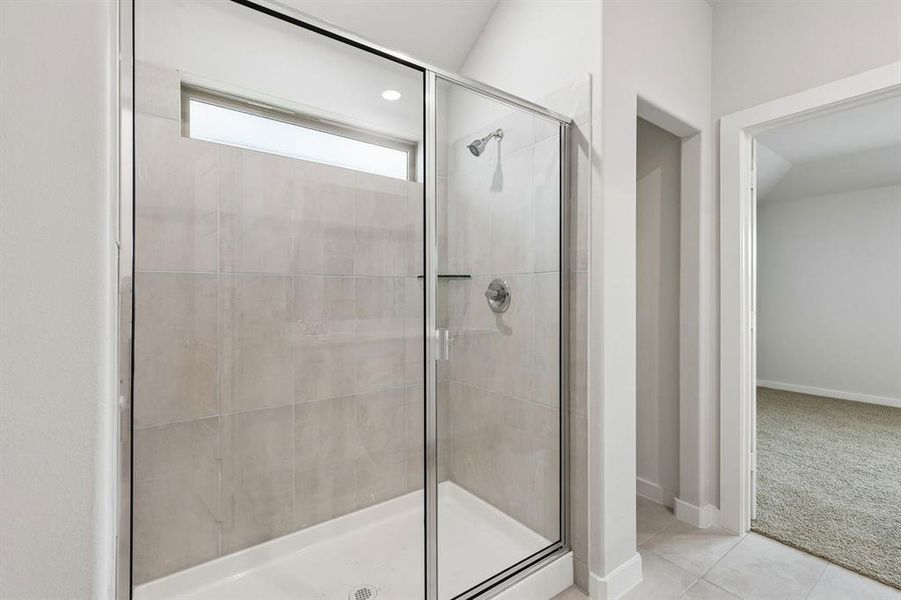 Primary Bathroom in the Oscar home plan by Trophy Signature Homes – REPRESENTATIVE PHOTO