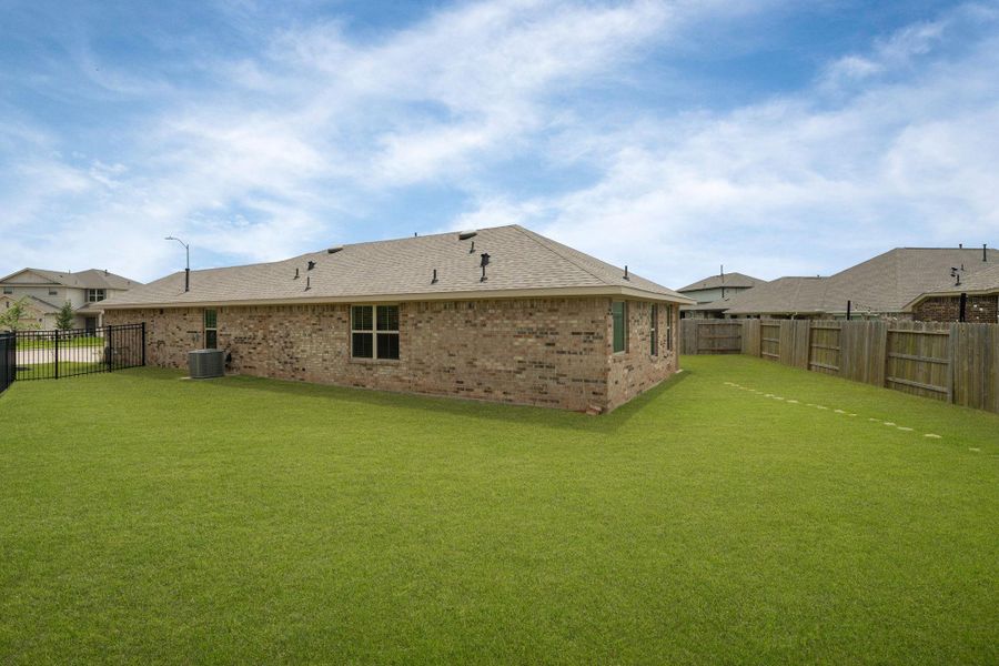 Exterior details and patio area of a home in Sunterra, Katy (Image 4).