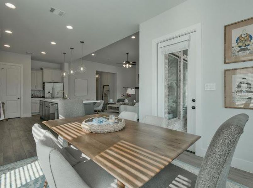 Dining area with light wood-style floors, recessed lighting, and a ceiling fan Dining area with light wood-style floors, recessed lighting, and a ceiling fan