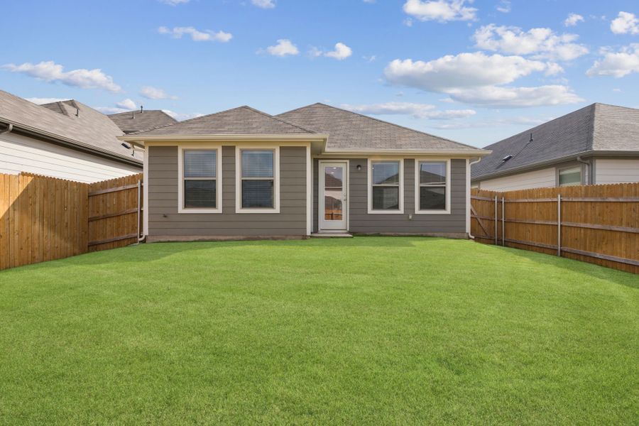 Yard in the Redbud home plan by Trophy Signature Homes - REPRESENTATIVE PHOTO