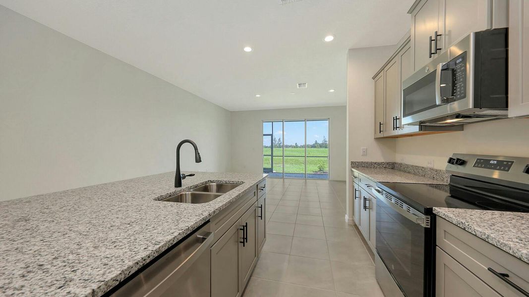Furnished interior view inside a new home in Palm Grove Real Estate and Homes for Sale in Lakewood Ranch, FL - Neal Communities, Lakewood Ranch (Image 8).