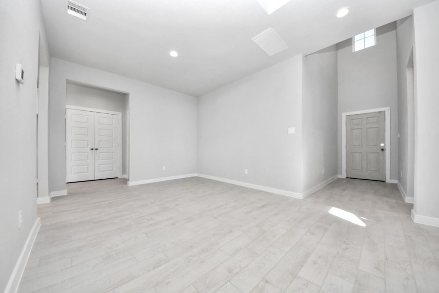 Make memories gathered around the table with your family and friends! This spacious dining room features elegant flooring, custom paint, and adjacent to family room and kitchen for open concept feel. Sample photo of completed home with similar floor plan. Actual colors and selections may vary.
