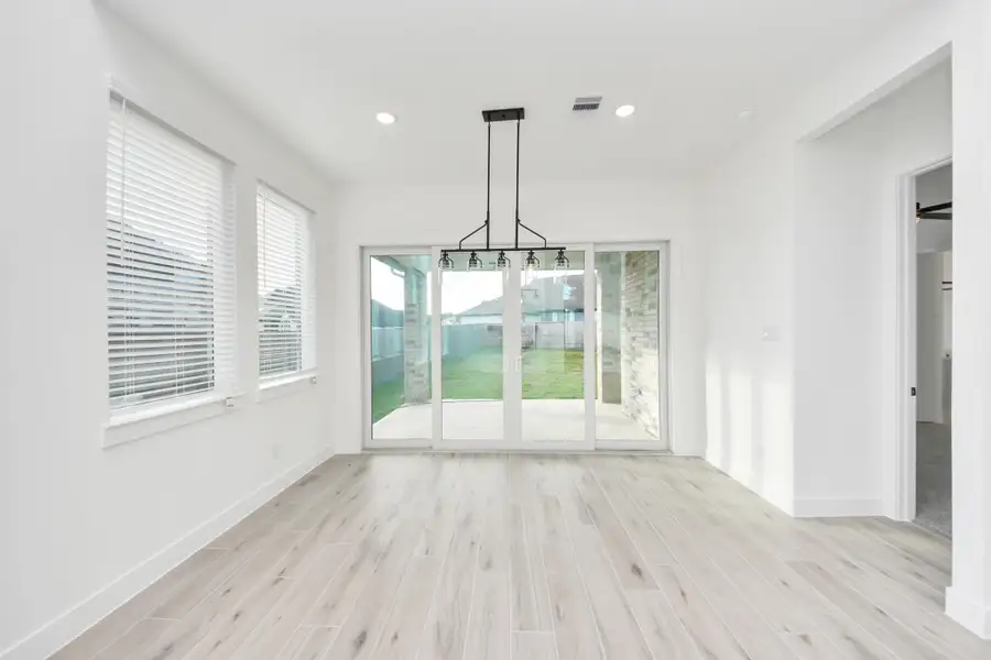 Spacious, unfurnished interior of a new home in Meridiana, Manvel (Image 27).