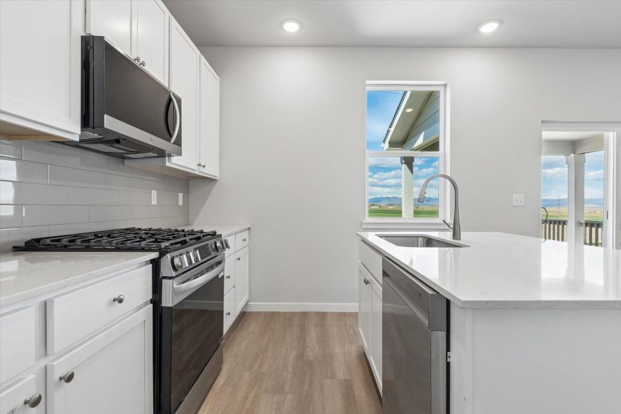 A kitchen with white cabinets. A kitchen with white cabinets.