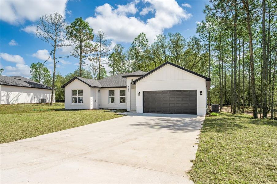 Front exterior of a new home in , Citrus Springs, FL, highlighting curb appeal (Image 2). Front exterior of a new home in , Citrus Springs, FL, highlighting curb appeal (Image 2).