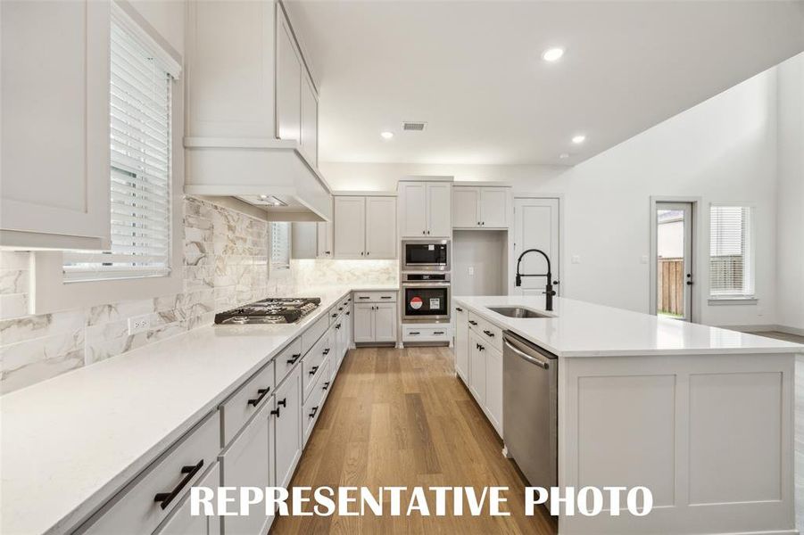 Beautiful cabinetry and gorgeous countertops paired with contemporary stainless steel create the kitchen of your dreams!  REPRESENTATIVE PHOTO