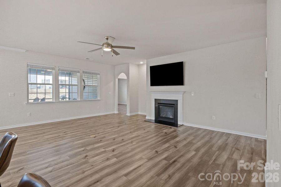 Breathtaking room to fill with your own style!  Gas fireplace, wall-mounted TV, upgraded contemporary ceiling fans and beautiful window blinds throughout. Plenty of room to enjoy entertaining or intimate spaces for a quiet retreat.