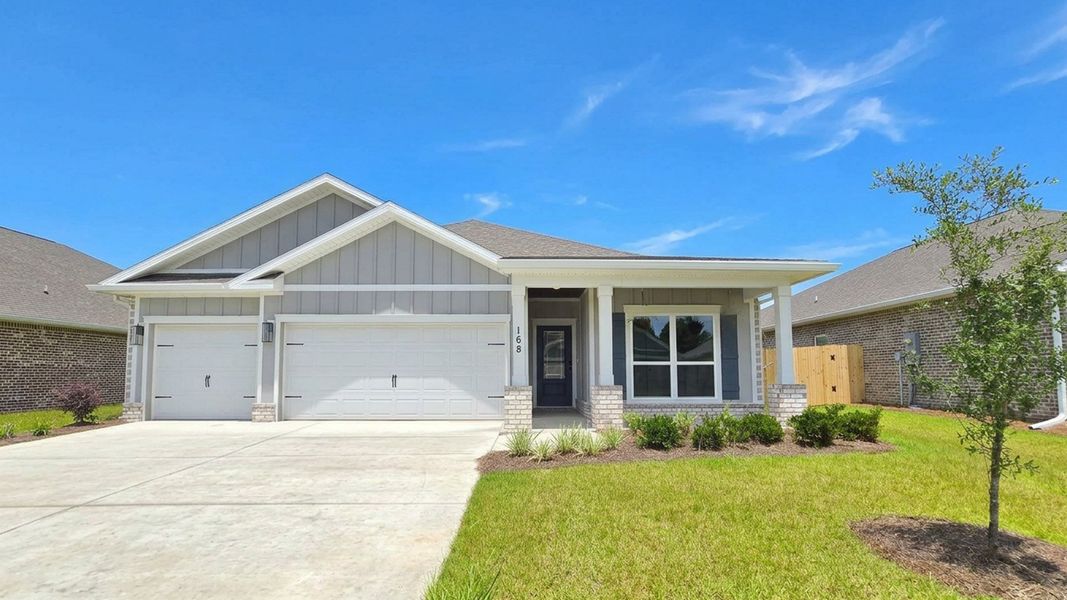 Front exterior of a new home in Owl's Head Farms, Freeport, FL, highlighting curb appeal (Image 1). Front exterior of a new home in Owl's Head Farms, Freeport, FL, highlighting curb appeal (Image 1).
