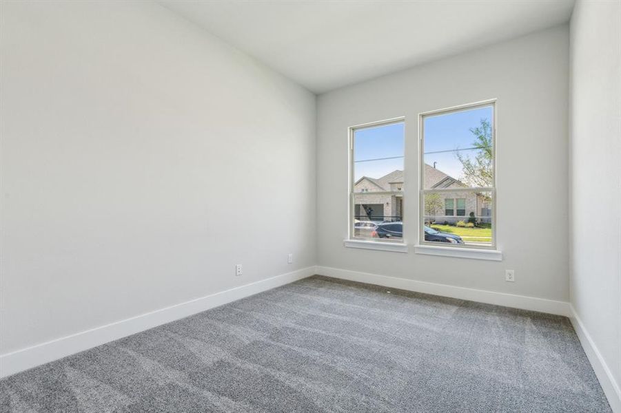 Empty room featuring carpet floors