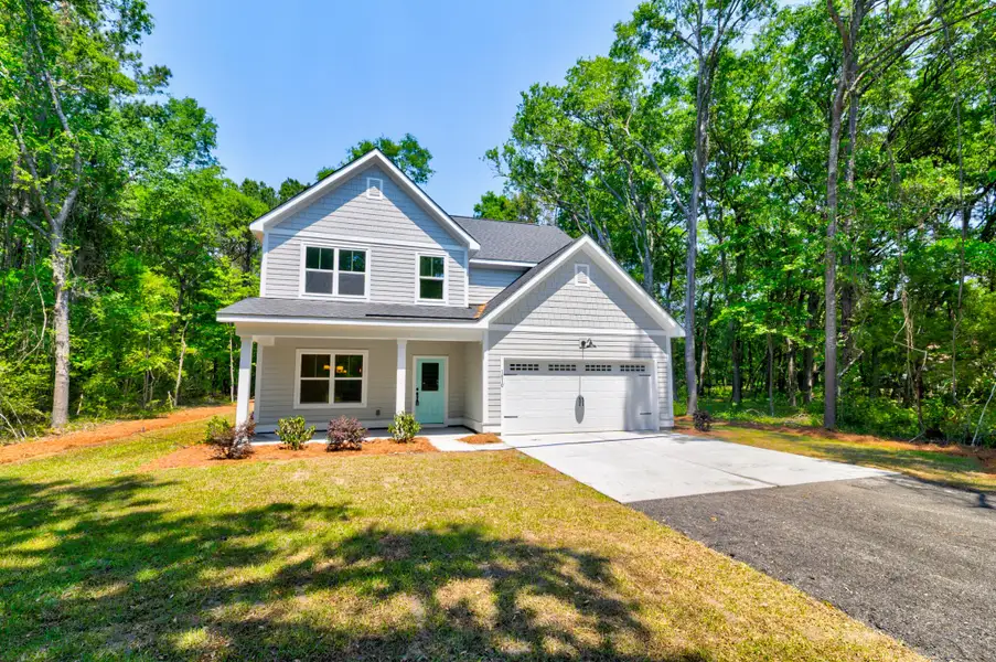 Front exterior of a new home in , Charleston, SC, highlighting curb appeal (Image 22).