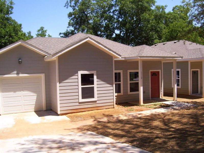 Single story home with concrete driveway, an attached garage, and roof with shingles Single story home with concrete driveway, an attached garage, and roof with shingles