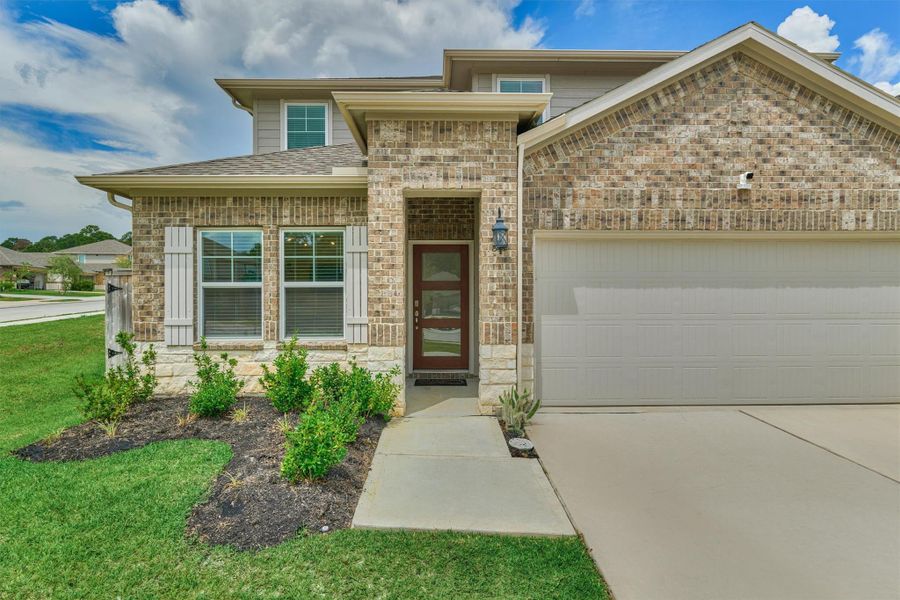 Front exterior of a new home in , Montgomery, TX, highlighting curb appeal (Image 22).